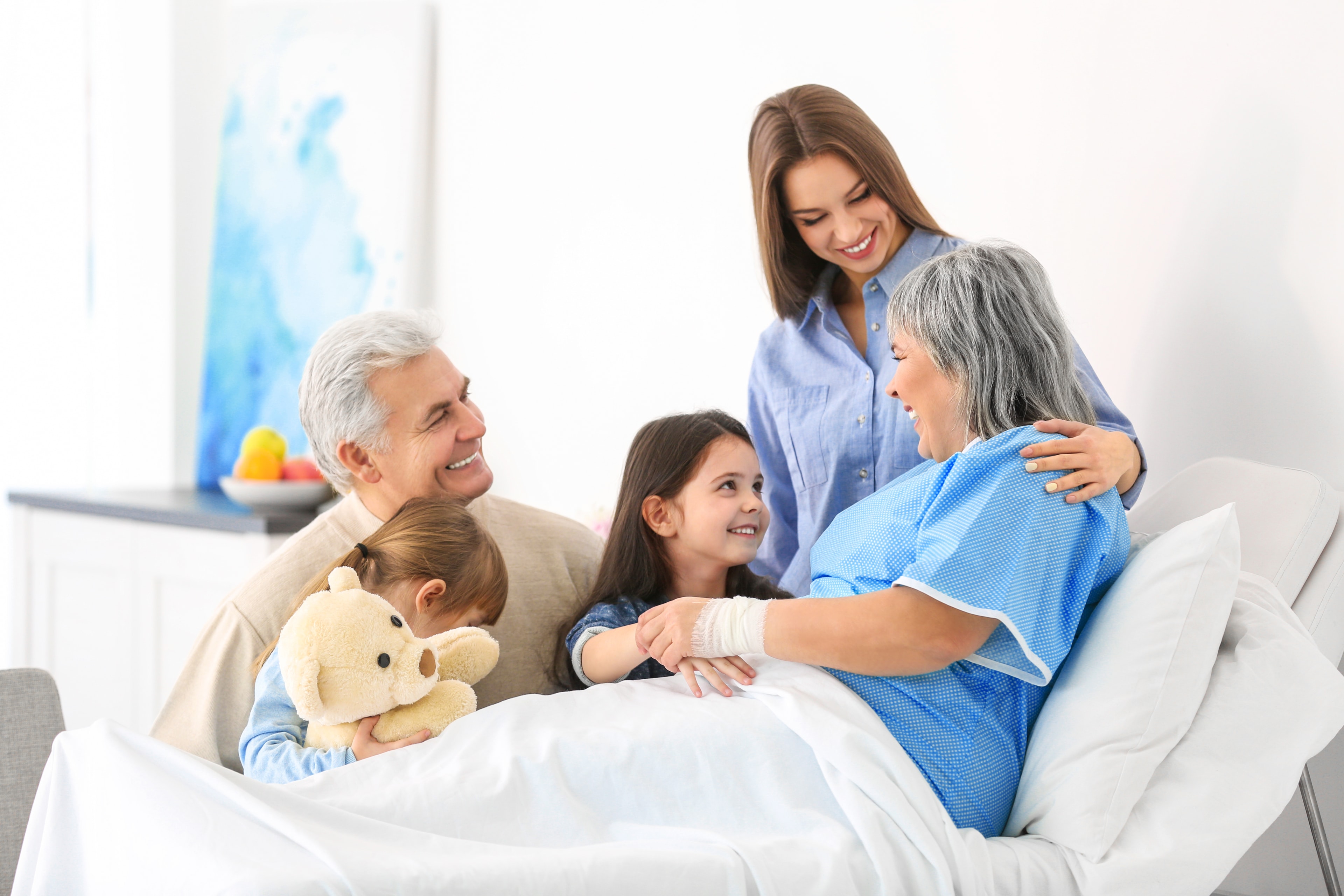 Family gathered around a loved one receiving hospice care