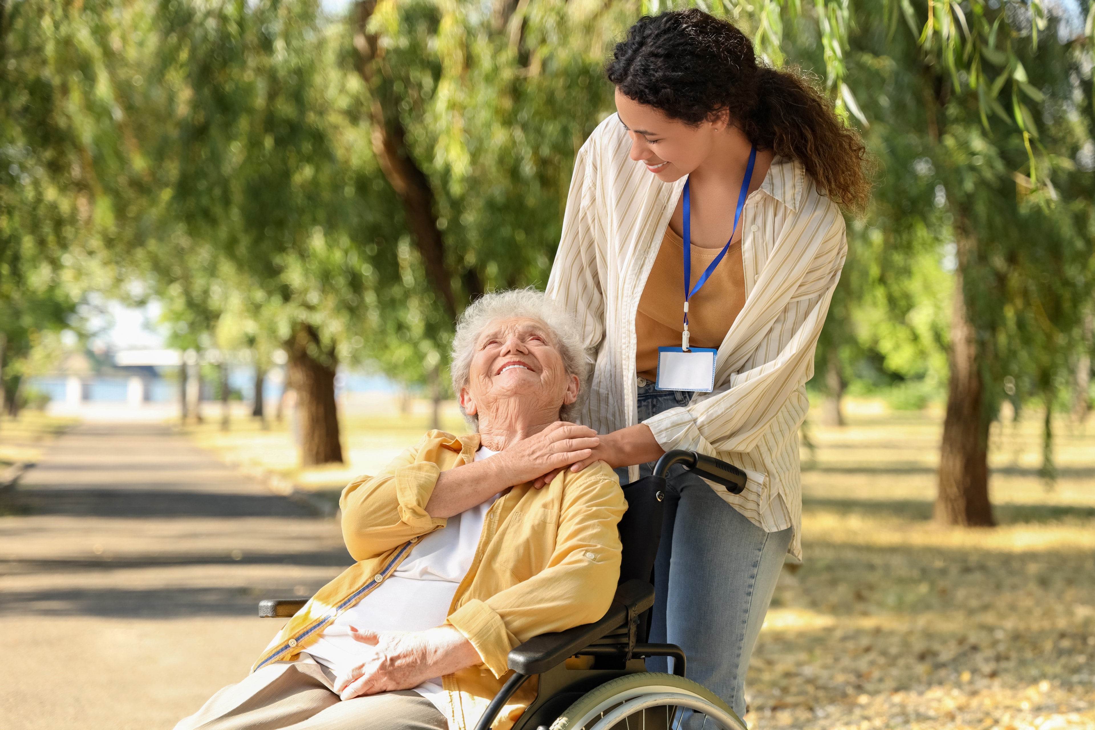 Caregiver with patient outdoors