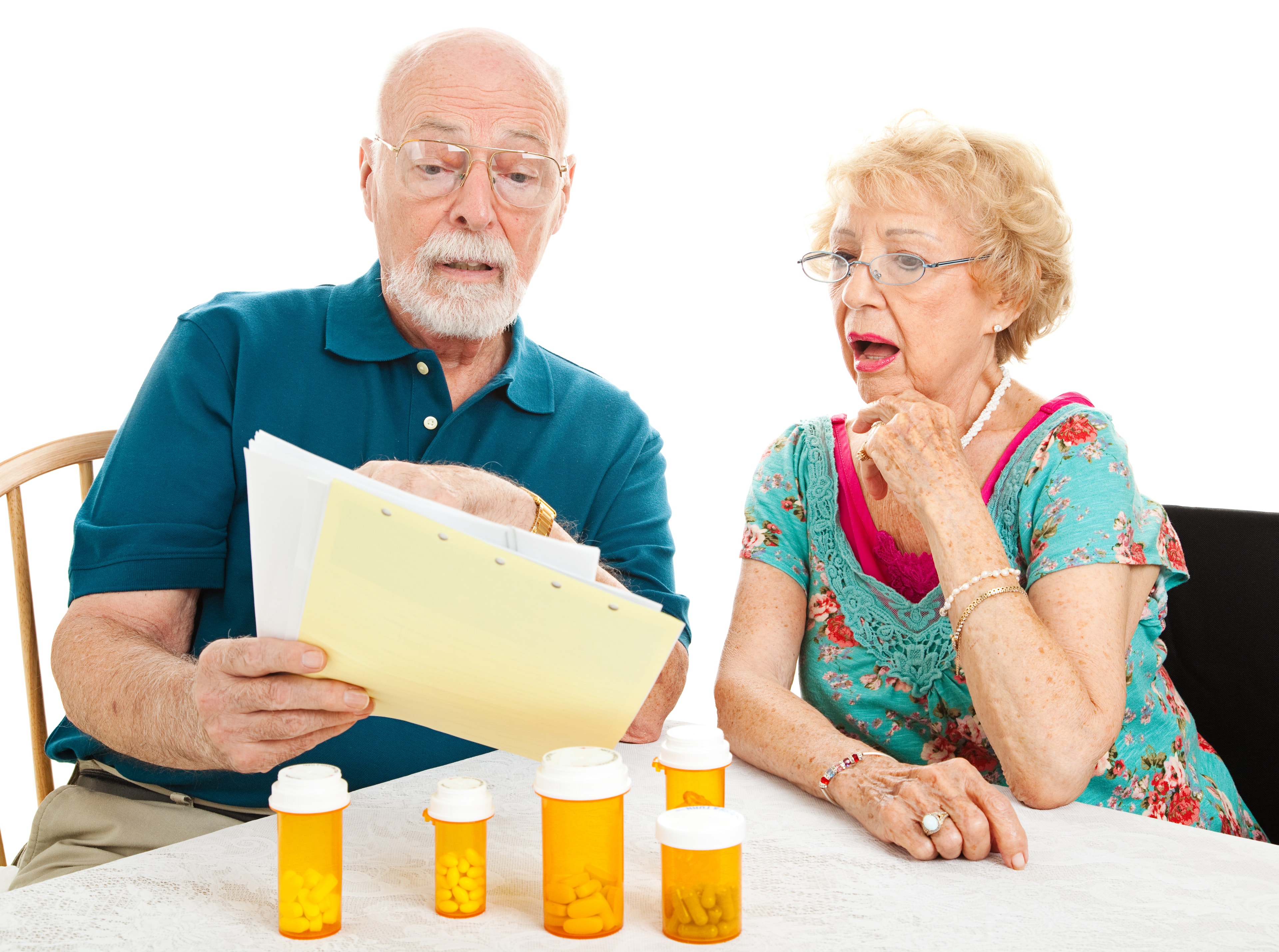 Seniors reviewing hospice care and insurance documents