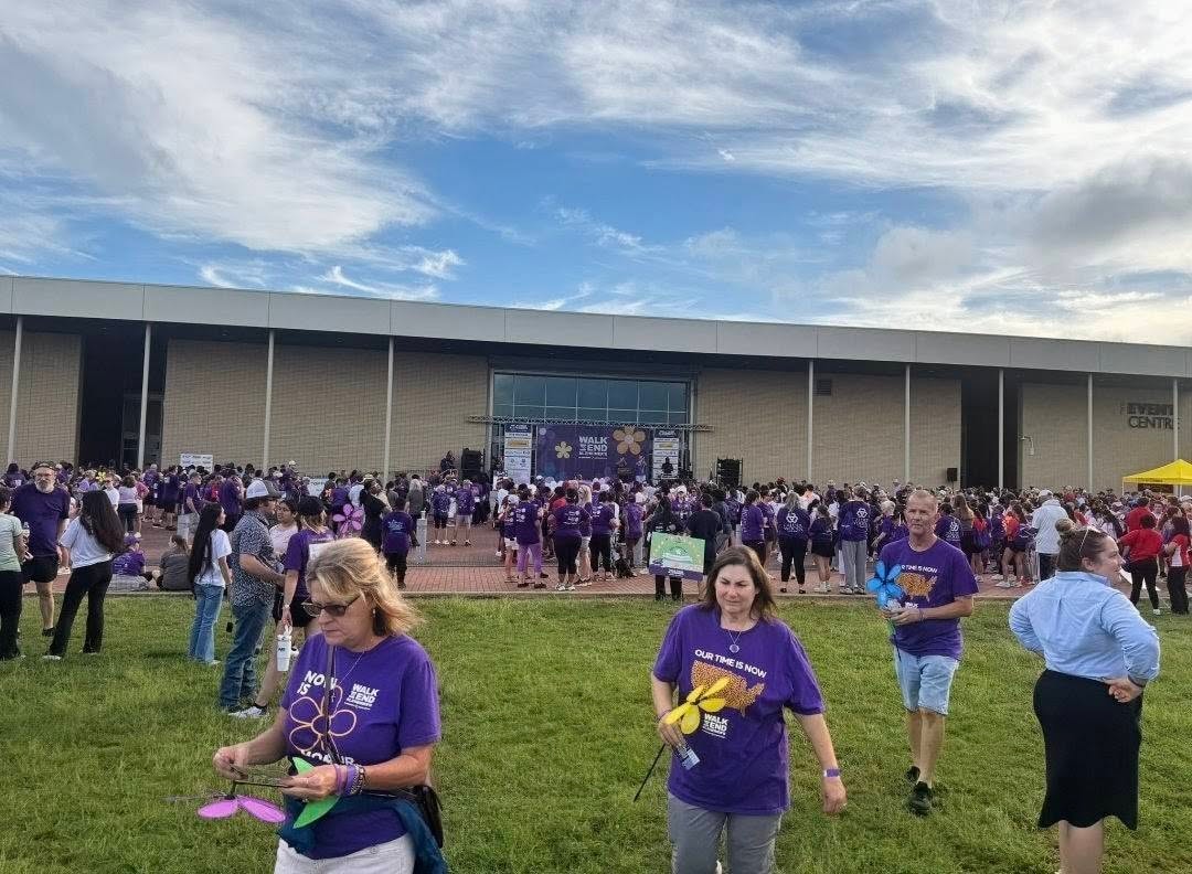 Crowd of participants in purple shirts at the Walk to End Alzheimer’s