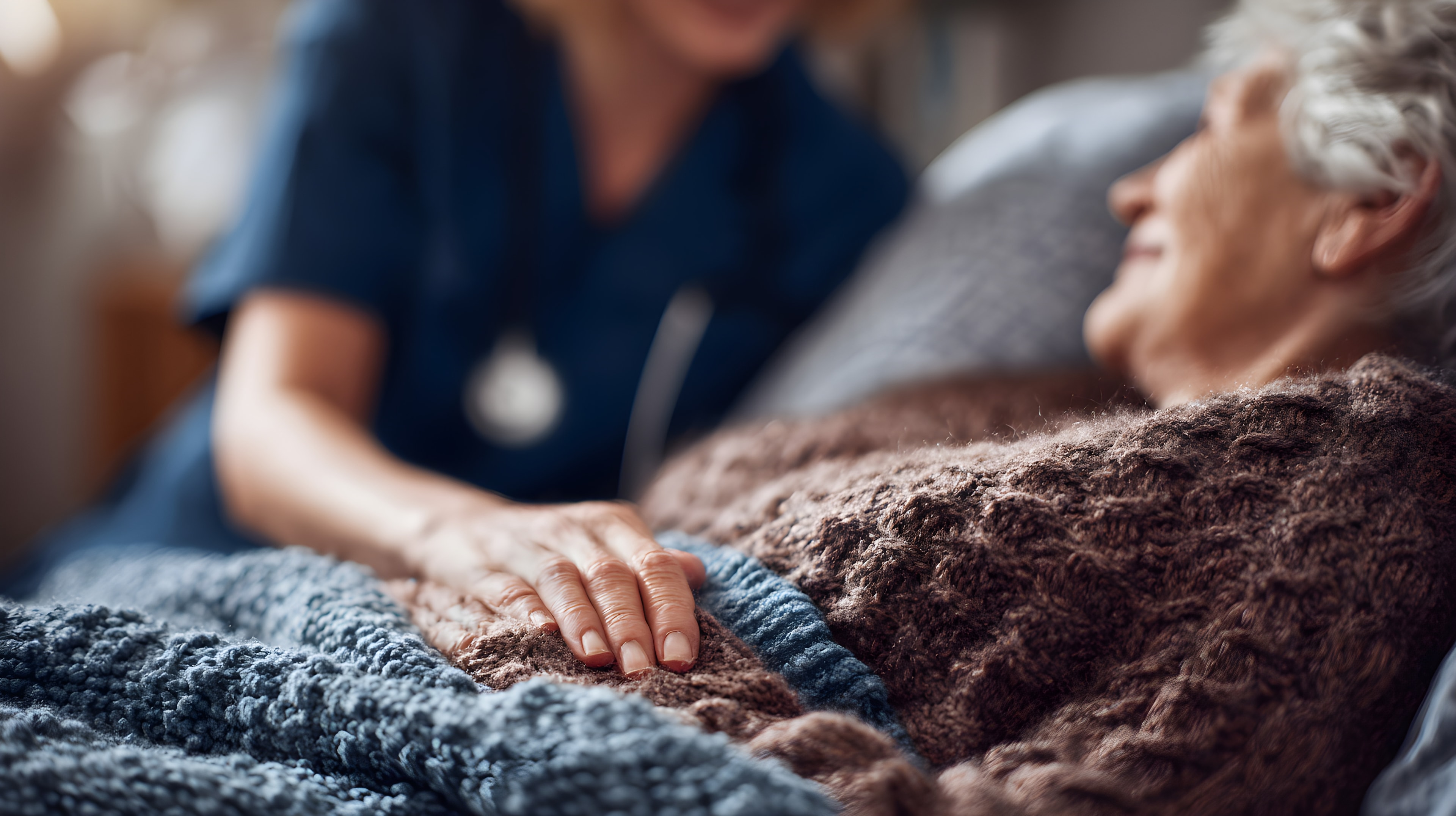 Hospice nurse providing compassionate care to an elderly patient.
