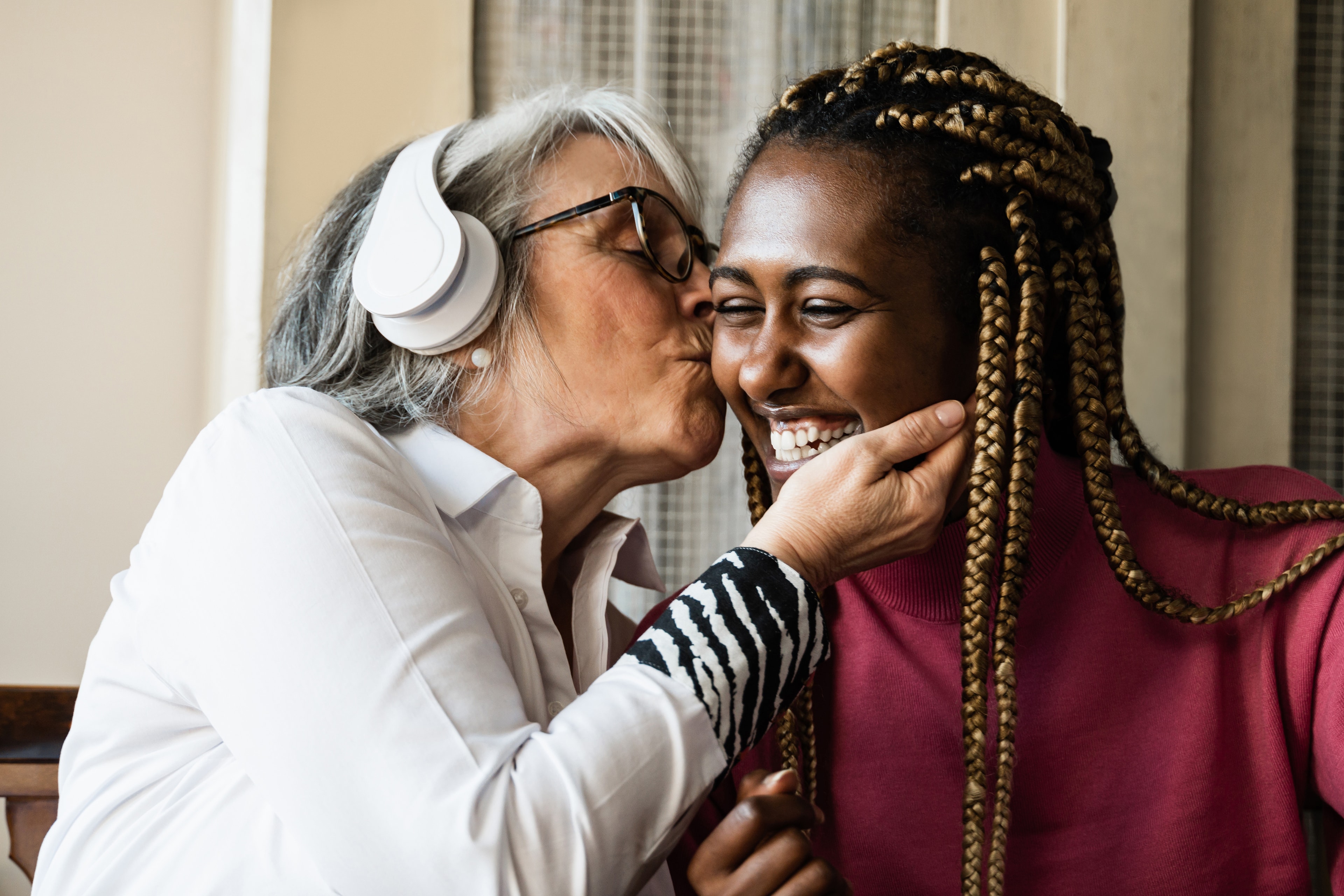 Warm joyful moment between a volunteer and resident